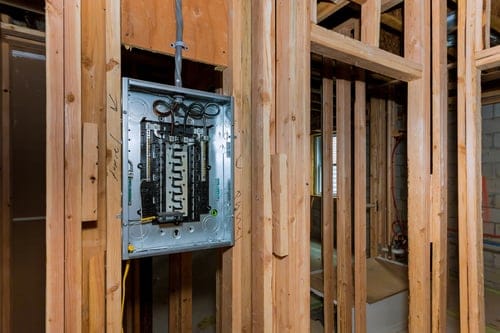 HVAC technician servicing a home air conditioning system